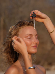 Pitta Dosha Drops being applied to face