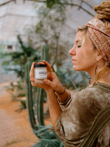 Woman holding White Jasmine Cloud Butter Lotion 4OZ jar