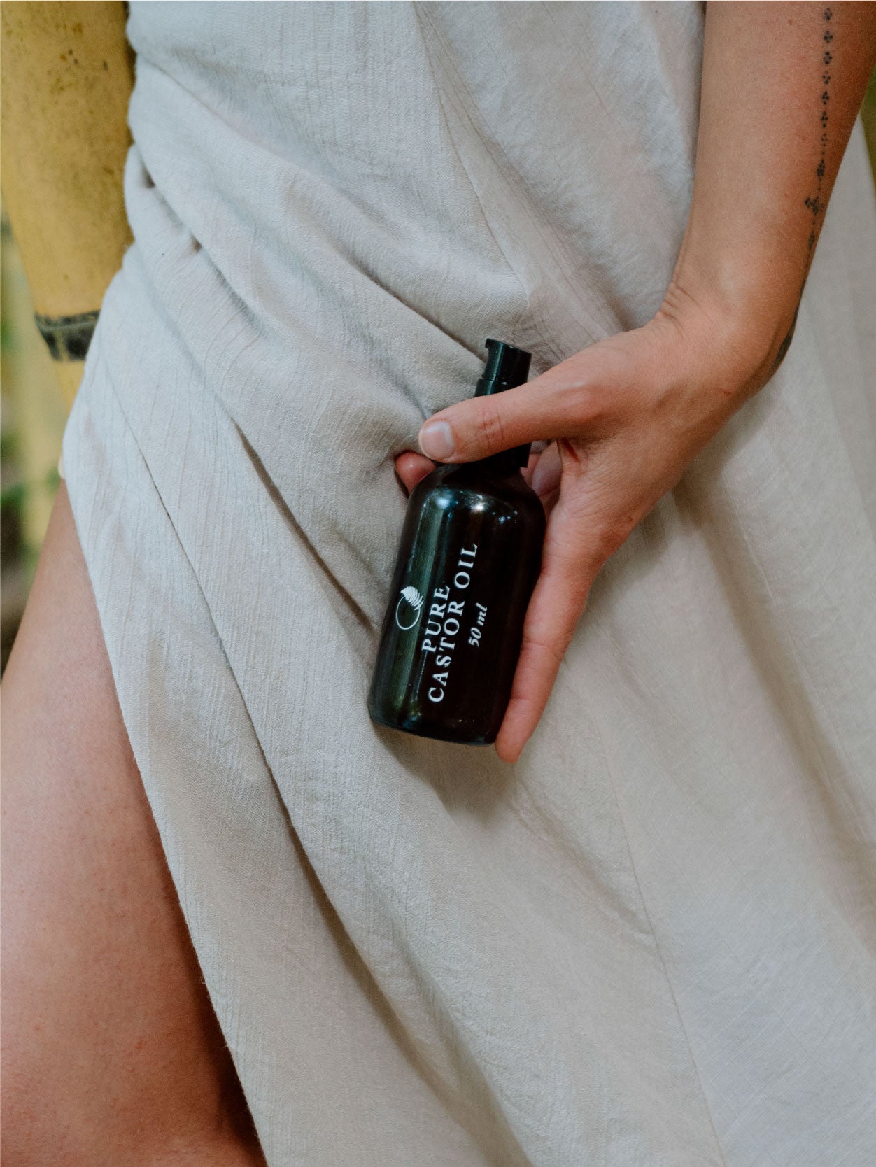 Castor oil abdominal pack ritual used to support digestion, lymphatic flow, and gentle detoxification