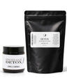 A product bundle containing a black jar of Underarm Detox and a large black stand-up pouch of ComelyHerbs Detox Magnesium Soak, both with white labels, on a white background.