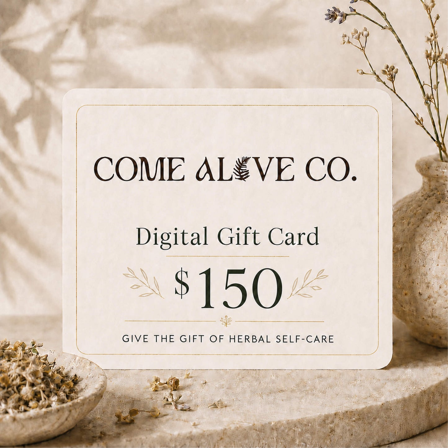 Come Alive Co. $150 digital gift card for herbal self-care, displayed on a cream card with botanical accents, dried herbs, and luxury wellness styling.