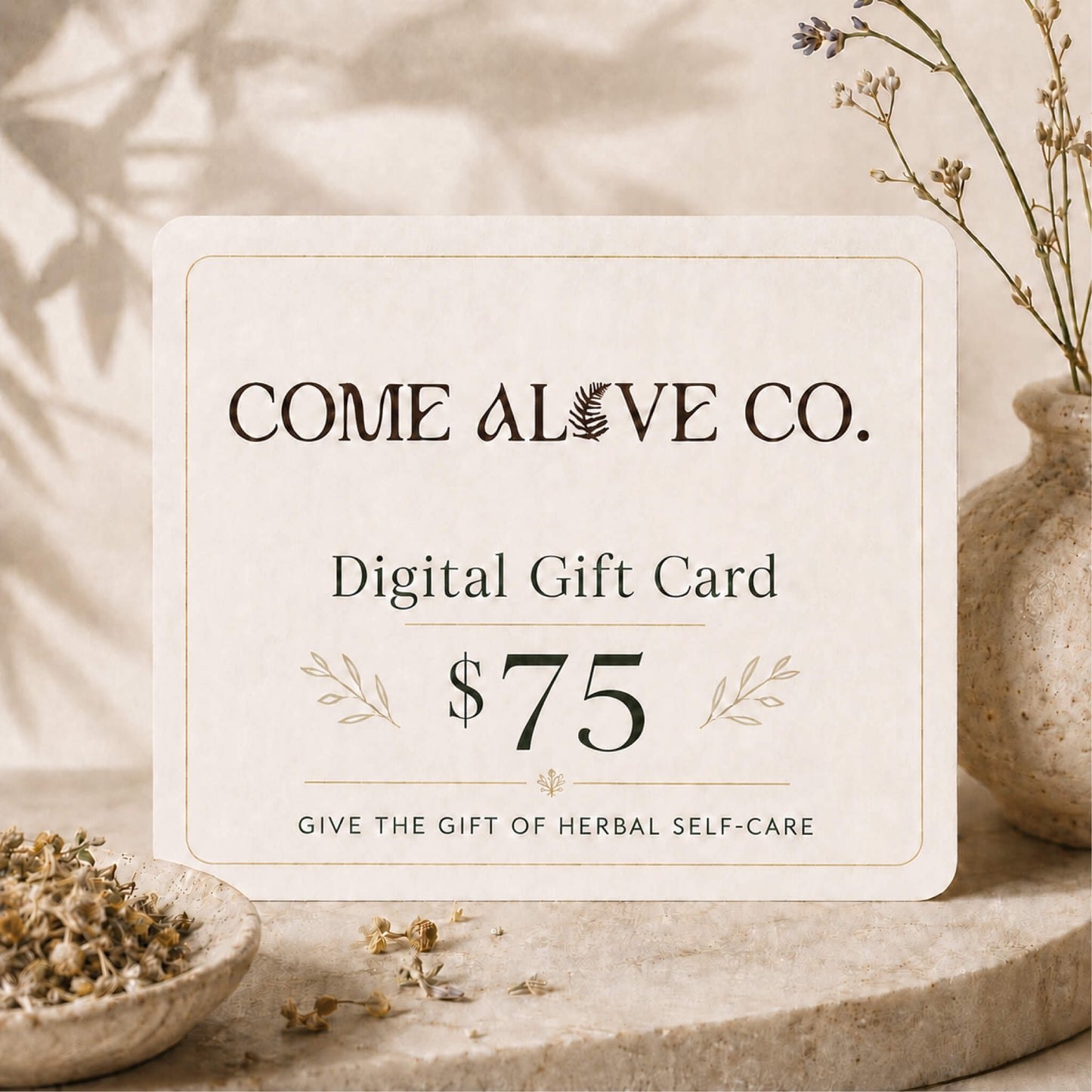 Come Alive Co. $75 digital gift card for herbal self-care, displayed on a cream card with botanical accents, dried herbs, and luxury wellness styling.